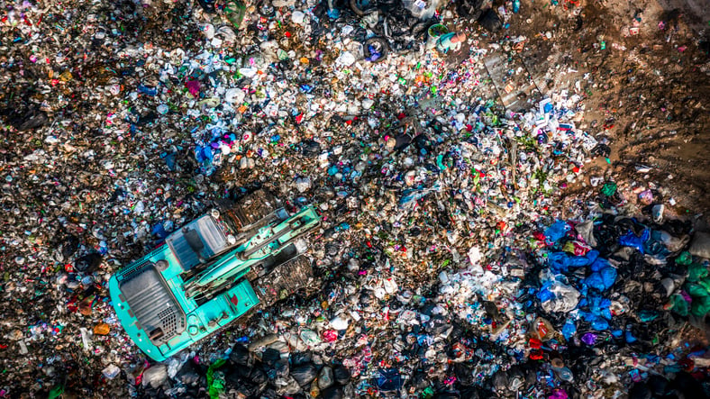 Plastic Bottle in a Landfill | Aqua ChemPacs 